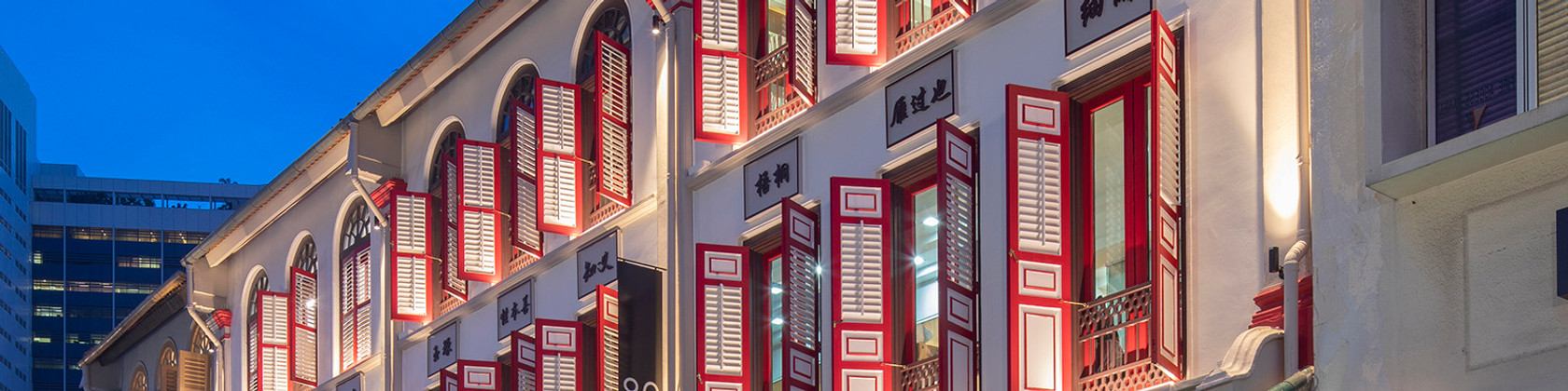 Historic shophouses in central Singapore at dusk